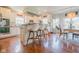 Bright and airy kitchen featuring white cabinets, an island with seating, and a cozy breakfast nook at 358 W Tansey Xing, Westfield, IN 46074
