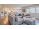 Open living room boasts hardwood floors and a view to the kitchen and dining area at 358 W Tansey Xing, Westfield, IN 46074