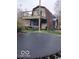 Backyard with the deck, the roof design and a trampoline at 38 Homestead Dr, Sheridan, IN 46069