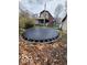 Exterior view of the deck, the roof design and a trampoline in the backyard at 38 Homestead Dr, Sheridan, IN 46069
