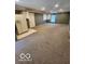 Unfinished basement featuring carpet, exposed beams and a refrigerator at 38 Homestead Dr, Sheridan, IN 46069