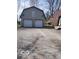 Exterior photo of a two-car detached garage with gravel driveway and window at 38 Homestead Dr, Sheridan, IN 46069
