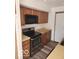 Kitchen featuring wood cabinets and modern appliances, including a stainless steel range at 38 Homestead Dr, Sheridan, IN 46069