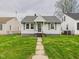 Charming bungalow featuring a well-manicured lawn and a welcoming walkway at 3826 Delaware St, Anderson, IN 46013