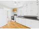 Functional kitchen featuring a white refrigerator, stove, and ample cabinet space at 3826 Delaware St, Anderson, IN 46013