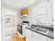 Compact kitchen with practical layout, wooden cabinets, and modern appliances at 3826 Delaware St, Anderson, IN 46013