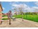 Outdoor patio area complete with a table, chairs, pergola, and a lush green lawn at 4013 Colonial Dr, Anderson, IN 46012