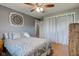 Serene bedroom showcasing a bed, wardrobe, and neutral color palette creating a calm and inviting space at 4013 Colonial Dr, Anderson, IN 46012