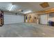 Spacious garage with ample room for parking and storage, featuring an overhead door at 4013 Colonial Dr, Anderson, IN 46012