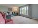 Bright living room with large windows, comfortable seating, and neutral decor provides a welcoming atmosphere at 4013 Colonial Dr, Anderson, IN 46012