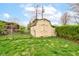 Backyard shed with a fenced-in area, providing extra storage space and utility at 4013 Colonial Dr, Anderson, IN 46012