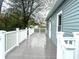 Spacious outdoor deck featuring white railing and gray decking is perfect for relaxing and entertaining at 410 S 25Th Ave, Beech Grove, IN 46107