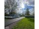 Charming single story home with manicured lawn, long driveway, and a detached garage at 410 S 25Th Ave, Beech Grove, IN 46107
