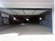 An empty garage interior with a concrete floor at 410 S 25Th Ave, Beech Grove, IN 46107