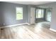 Bright and airy living room featuring neutral walls and stylish light wood flooring and ample natural light at 410 S 25Th Ave, Beech Grove, IN 46107