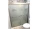 Modern bathroom featuring a shower with sliding glass doors and decorative pattern for privacy at 410 S 25Th Ave, Beech Grove, IN 46107