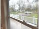 View from the window to the front of the property with a white fence at 410 S 25Th Ave, Beech Grove, IN 46107