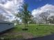 Large lot with mature trees and green grass at 410 S 25Th Ave, Beech Grove, IN 46107