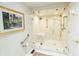 Beautiful glass enclosed shower with built-in bench and gold hardware at 411 Sugar Tree Ln, Indianapolis, IN 46260