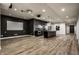 Finished basement with kitchen, projector screen, and sleek modern design at 4292 Alderborough Way, Zionsville, IN 46077