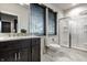 Bathroom with vanity, toilet, and enclosed glass shower with gray and white marble floors at 4292 Alderborough Way, Zionsville, IN 46077