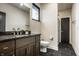 Bathroom with wood vanity, and shower with a matte black door at 4292 Alderborough Way, Zionsville, IN 46077