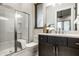 Bathroom showcasing a glass-enclosed shower, modern vanity, and sleek fixtures at 4292 Alderborough Way, Zionsville, IN 46077
