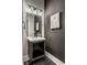 Bathroom with modern vanity, stylish lighting, and contemporary artwork at 4292 Alderborough Way, Zionsville, IN 46077