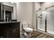 Bathroom with glass shower, dark vanity, modern toilet and decor at 4292 Alderborough Way, Zionsville, IN 46077