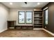 Bonus room with a built-in desk, built-in shelves, and a window bench at 4292 Alderborough Way, Zionsville, IN 46077