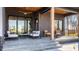 Relaxing covered patio with modern furniture, fan, and wooden ceiling at 4292 Alderborough Way, Zionsville, IN 46077