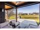 View of the outdoor living space with a beautiful stamped concrete patio and golf course views at 4292 Alderborough Way, Zionsville, IN 46077