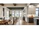 Open concept view of the dining area showcasing the dark ceiling, kitchen, and hardwood floors at 4292 Alderborough Way, Zionsville, IN 46077