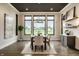 Formal dining room with hardwood floors, a dark ceiling, and natural light from the large windows at 4292 Alderborough Way, Zionsville, IN 46077