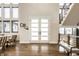 Bright foyer featuring hardwood floors, modern staircase, and an open concept design at 4292 Alderborough Way, Zionsville, IN 46077
