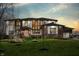 Stunning two-story home at twilight with a meticulously maintained lawn, modern windows, and inviting exterior lighting at 4292 Alderborough Way, Zionsville, IN 46077