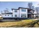 Backyard view of the home featuring a covered patio and outdoor living area at 4292 Alderborough Way, Zionsville, IN 46077