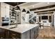Beautiful kitchen with marble countertops, spacious island, and an open view to the staircase and living room at 4292 Alderborough Way, Zionsville, IN 46077