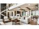 Spacious living room with high ceilings, fireplace, and elegant decor, creating a warm and inviting atmosphere at 4292 Alderborough Way, Zionsville, IN 46077