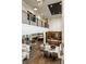 Spacious living room with open floor plan, hardwood floors, soaring ceilings, elegant furniture, and abundant natural light at 4292 Alderborough Way, Zionsville, IN 46077