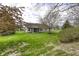 Large backyard with a screened-in porch, mature landscaping, and a well-maintained lawn, perfect for outdoor entertaining at 5288 Ivy Hill Dr, Carmel, IN 46033