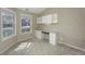A bedroom that can be used as an office featuring white cabinets and two windows at 5288 Ivy Hill Dr, Carmel, IN 46033