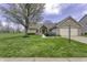 Charming single-story home featuring brick and vinyl siding with a well-manicured lawn and attached two-car garage at 5288 Ivy Hill Dr, Carmel, IN 46033