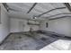 Spacious two-car garage with storage shelves, electrical, door to inside, and concrete floor at 5288 Ivy Hill Dr, Carmel, IN 46033