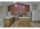 Bright kitchen with wood cabinets, stainless steel appliances, and an island at 5288 Ivy Hill Dr, Carmel, IN 46033