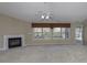 Spacious living room with fireplace and large windows for natural light at 5288 Ivy Hill Dr, Carmel, IN 46033