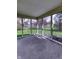This screened-in porch allows views of the fenced-in backyard and mature trees at 5288 Ivy Hill Dr, Carmel, IN 46033