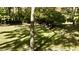 Spacious backyard with plenty of green space, mature trees, and a peaceful ambiance at 5528 State Road 144, Greenwood, IN 46143
