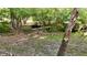 Picturesque backyard with a stream, bridge, and lush foliage creates a peaceful oasis at 5528 State Road 144, Greenwood, IN 46143