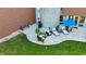 Aerial view of the home's beautiful backyard and patio area with ample seating and landscaping at 5528 State Road 144, Greenwood, IN 46143
